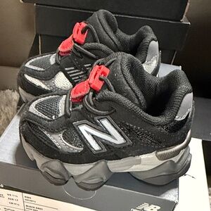 New Balance Kids Black and Gray Sneakers with Red Accents